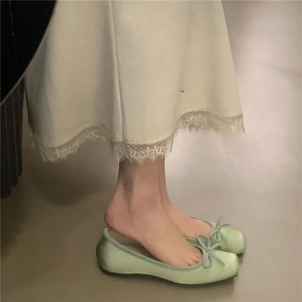 Women's satin shoes with hidden heels, square head and bow detail, available in six solid colours, sizes 35-40.