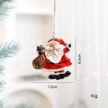 Small resin Christmas pendant ornament biscuit man figure with love motif on festive tree