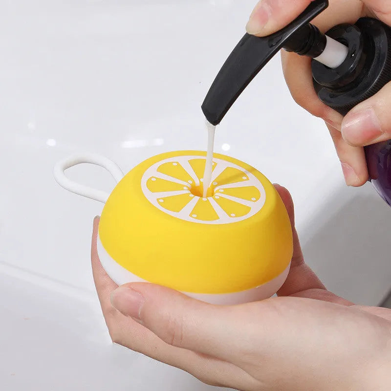 Yellow silicone pet bath brush showing massage head and combed grooming sides for dog and cat washing