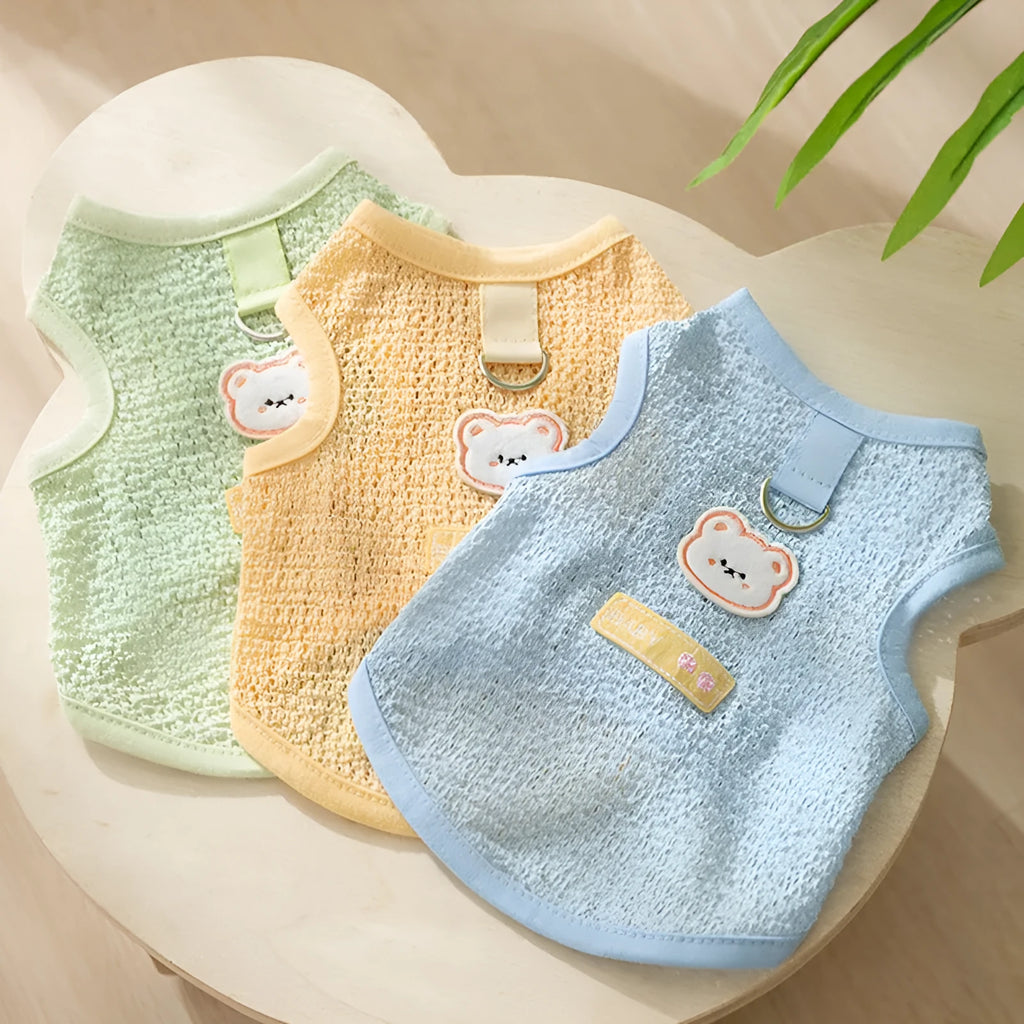 Bear patch cat clothing in hollowed-out knitted fabric shown in blue, green and yellow colours