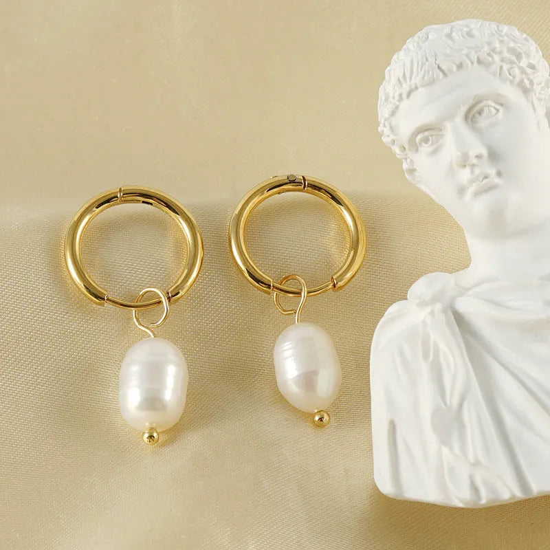 Gold geometric pearl earrings made from stainless steel with titanium steel components