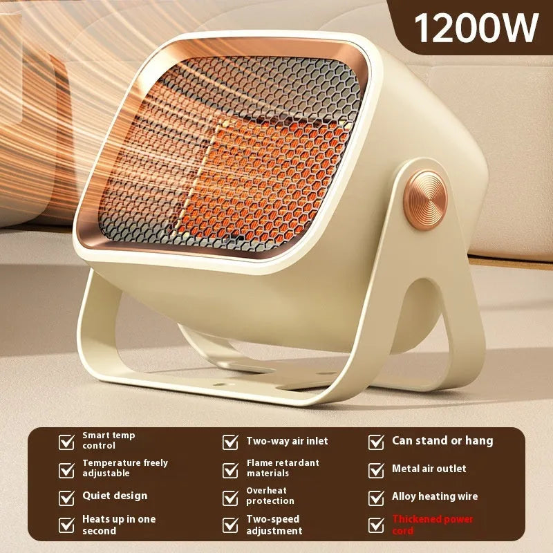 Grey compact desktop ceramic electric heater with rotatable body on a wooden desk.
