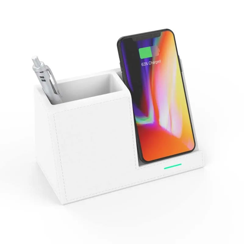 Black leather wireless charging station with phone on stand and pens in holder