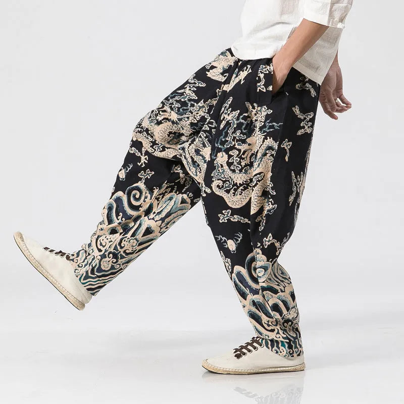 Men's hip hop cross pants with dragon print pattern and elastic waist in loose harem style.