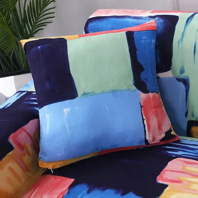 Geometric patterned stretch sofa slipcover on a modern three-seater sofa.