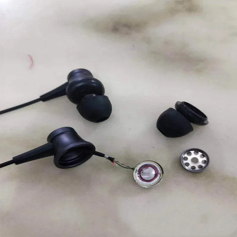 Piston style in-ear wired headphones with 3.5mm plug in black, blue, and red colour options.
