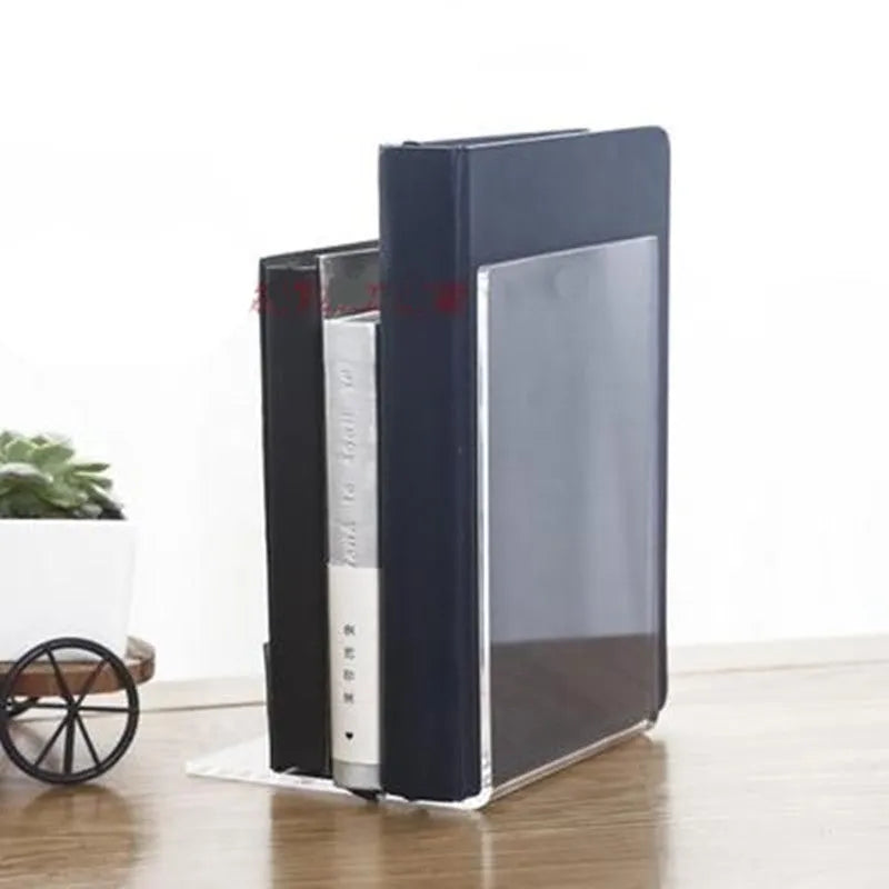 Transparent acrylic bookcase displaying textbooks on smooth-edged plexiglass shelf