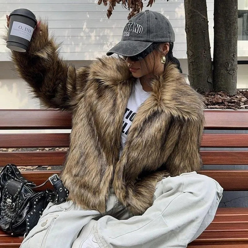 Artificial fur coat with fox fur style design in black tip colour variation