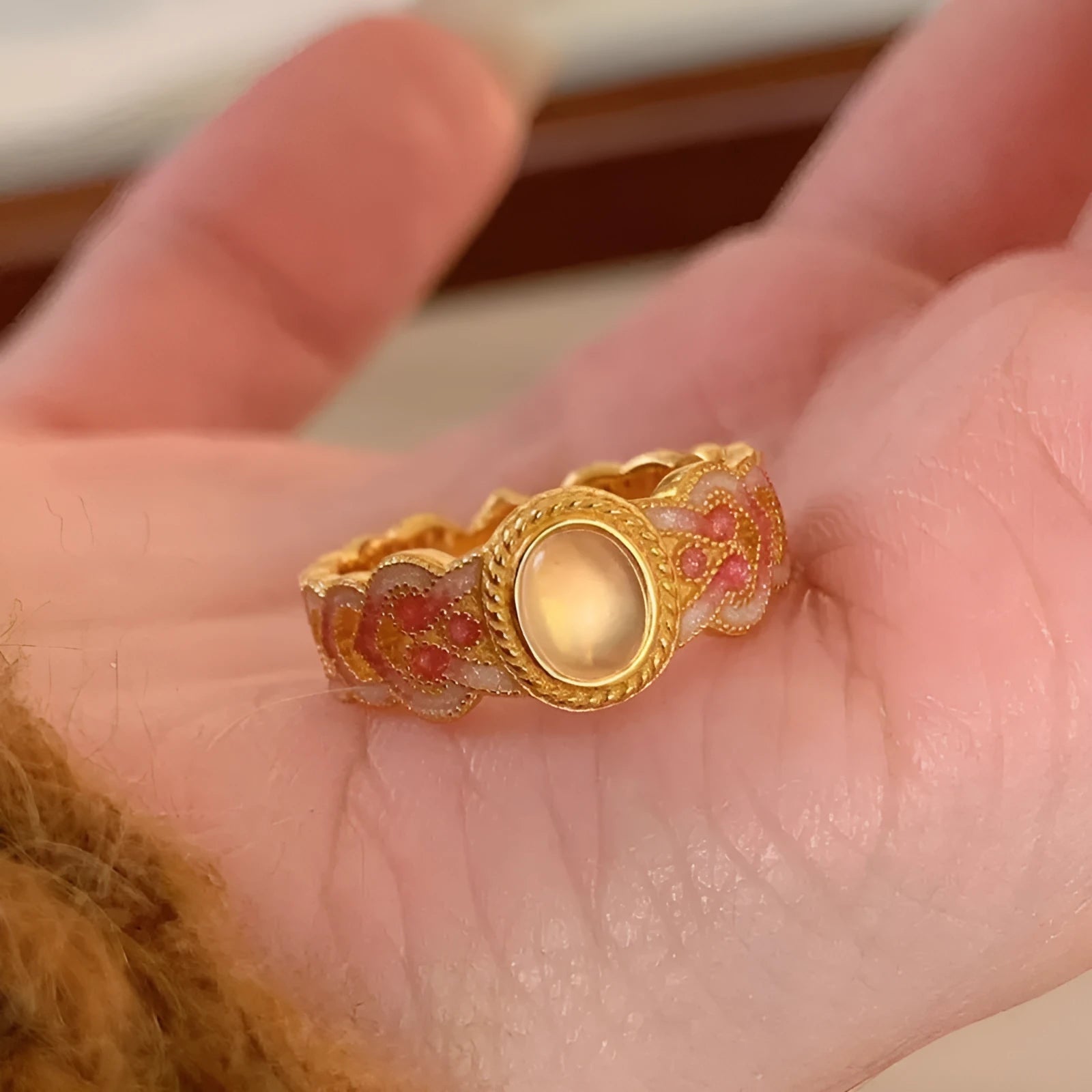Pink crystal enamel geometric open-mouth ring on a gold-plated copper band.