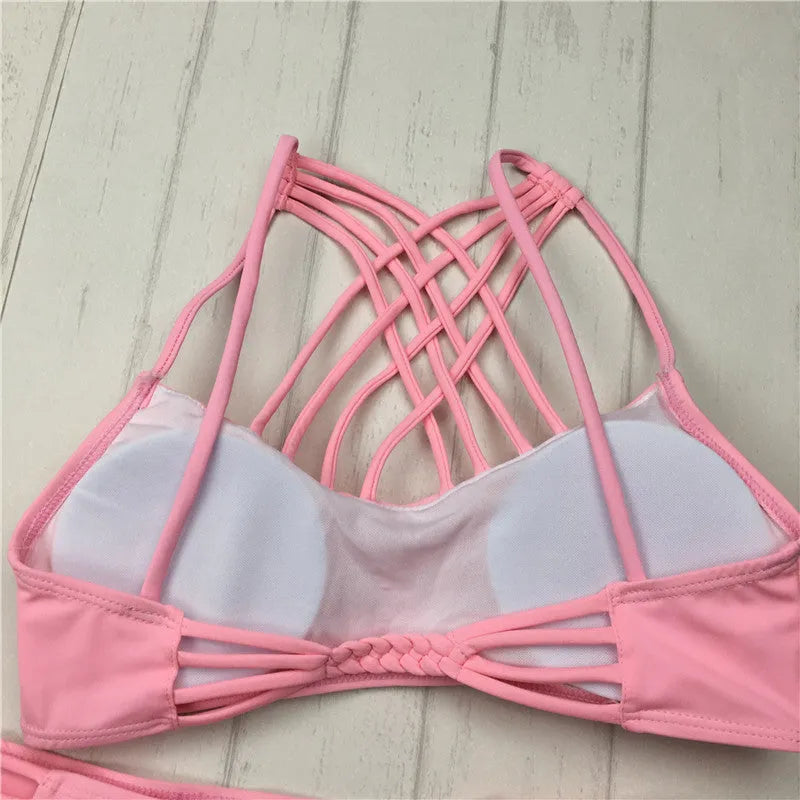 Women's pink cut out halter bikini swimsuit with bandage design and cross front details