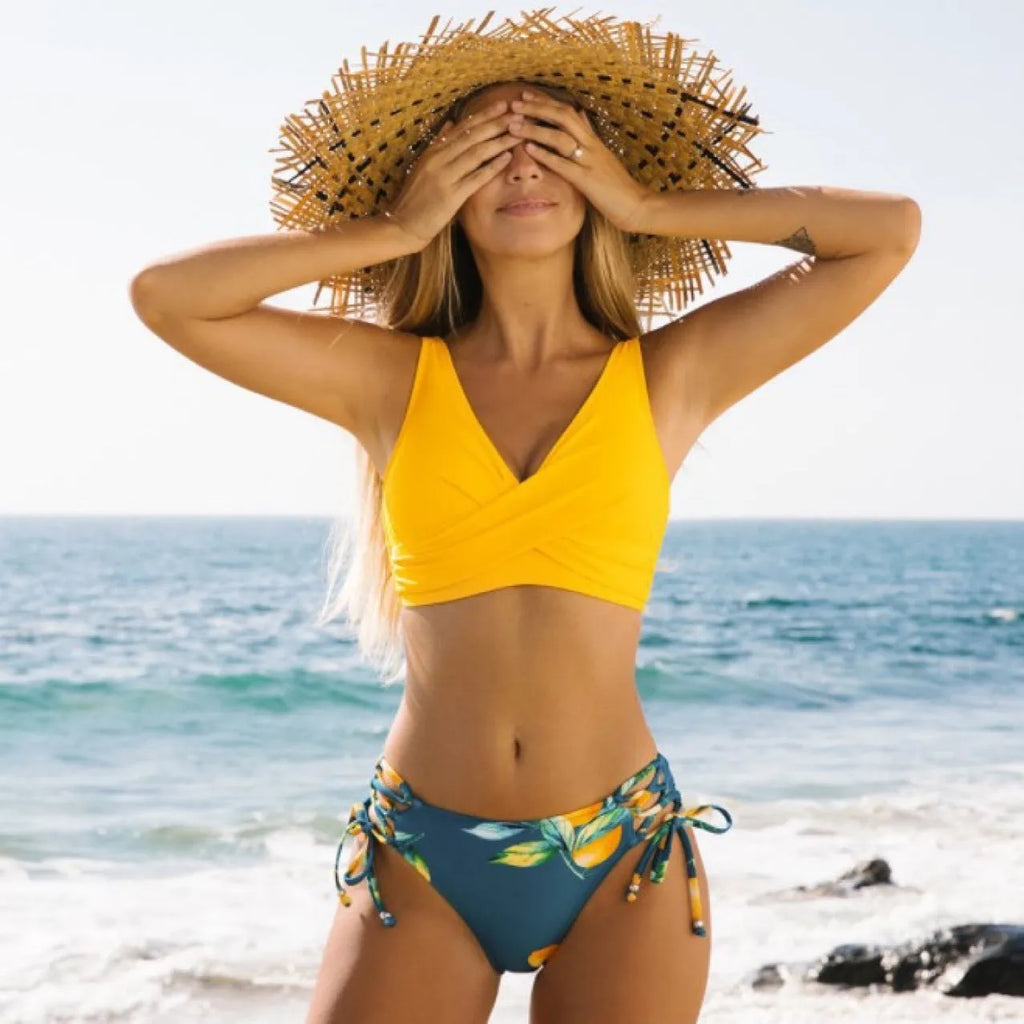 Yellow bikini swimsuit for women, sleeveless briefs style, nylon fabric, cotton blend lining, sizes S to 2XL