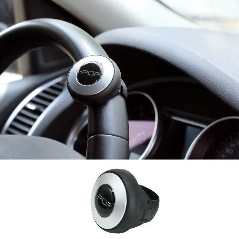 Car steering wheel spinner knob in black with metal fixing ring and screw for one-handed driving assistance