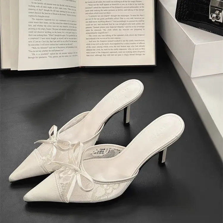 Women's light brown lace bowknot pointed toe high heels with mesh upper on a neutral background