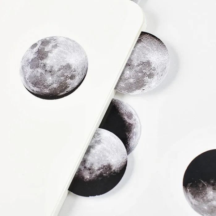 Boxed sheet of 45 black moon phase and calendar planet stickers on self-adhesive paper.
