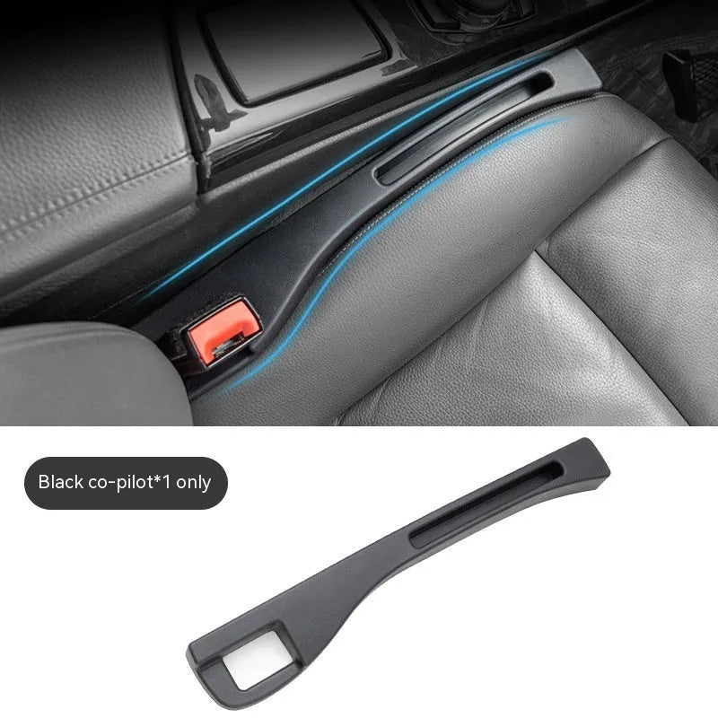 Black plastic car seat gap storage box organiser with handle between vehicle seats