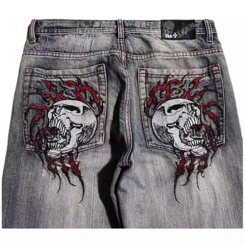 Grey washed-out wide-leg men's jeans with a straight cut and mid-waist design on a neutral background.