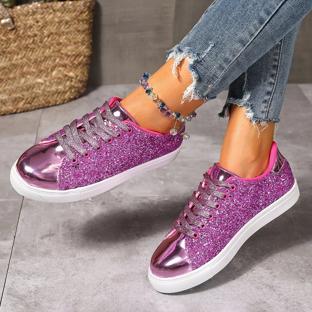 Women's plus size sequined board shoes in black with front lace-up fastening and flat rubber sole.