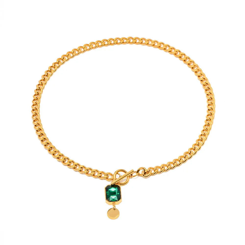 Gold geometric round pendant necklace on Cuban link chain with French retro styling
