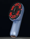 Red and black atomized massage comb with USB Type-C charging port and atomiser reservoir.