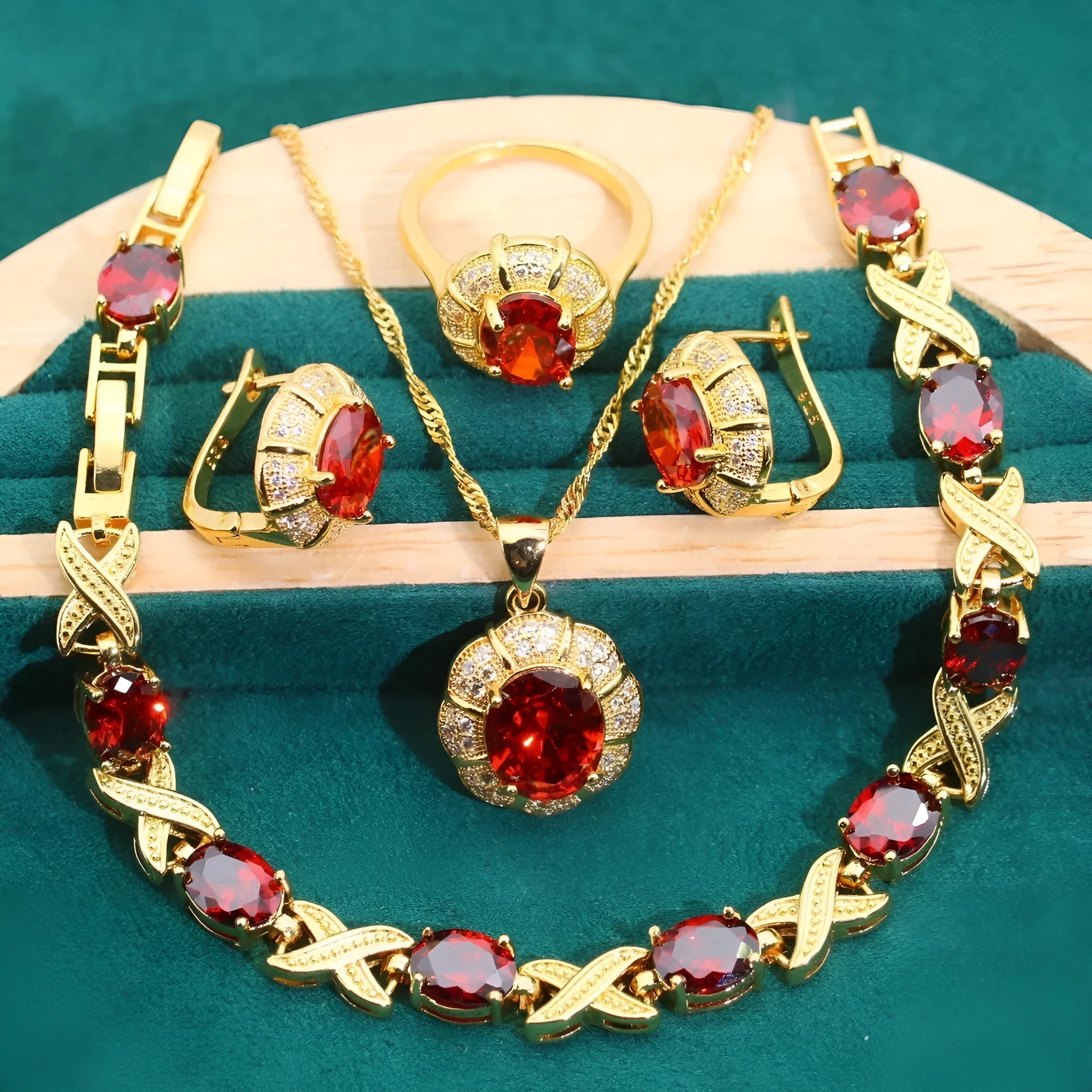 Gold plated cubic zirconia jewellery set with necklace, earrings, ring, and bracelet in blue, green, purple, or red.