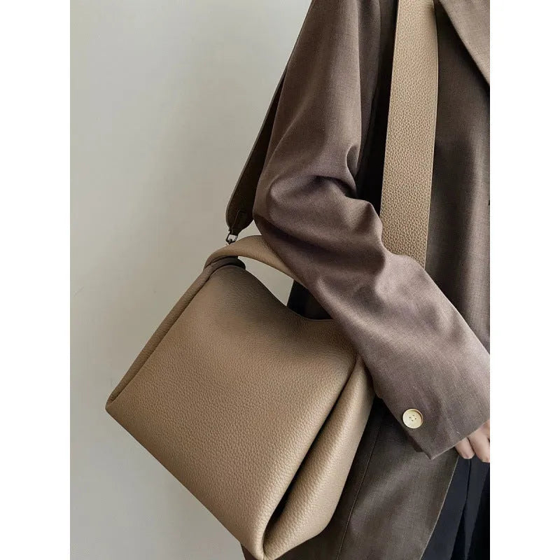 Grey women's corduroy shoulder messenger bag with adjustable strap, 24x10x17 cm, on a plain background.