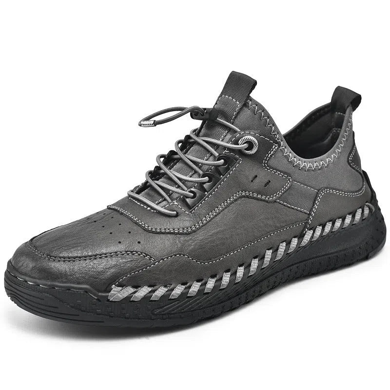 Men's hand-stitched round toe sneakers in black synthetic PU, low heel 1-3 cm, lace-up closure, side view