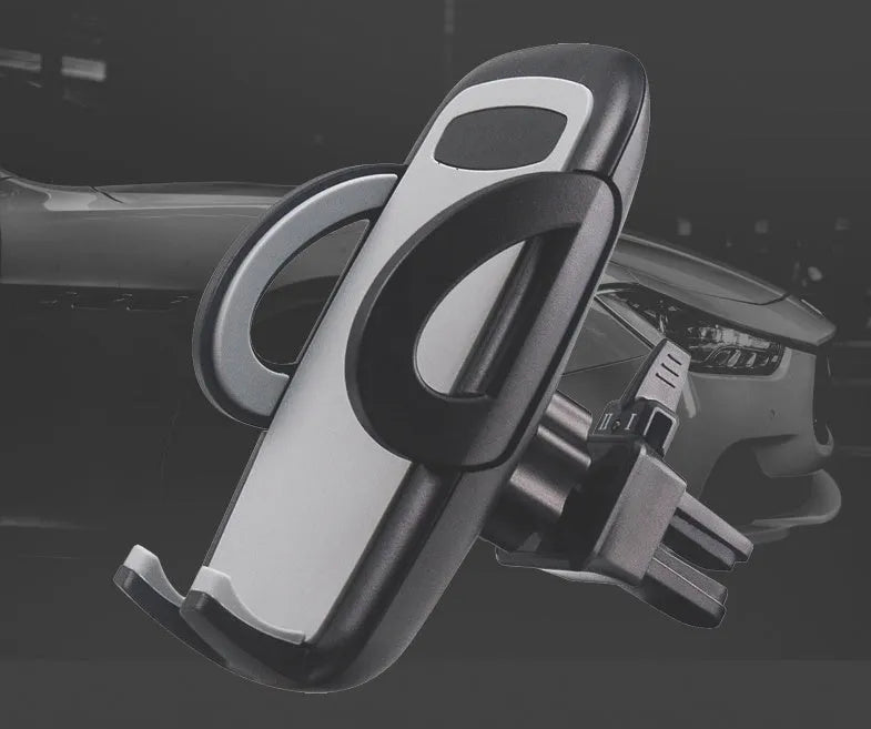 Black plastic mobile phone holder attached to car air conditioning vent