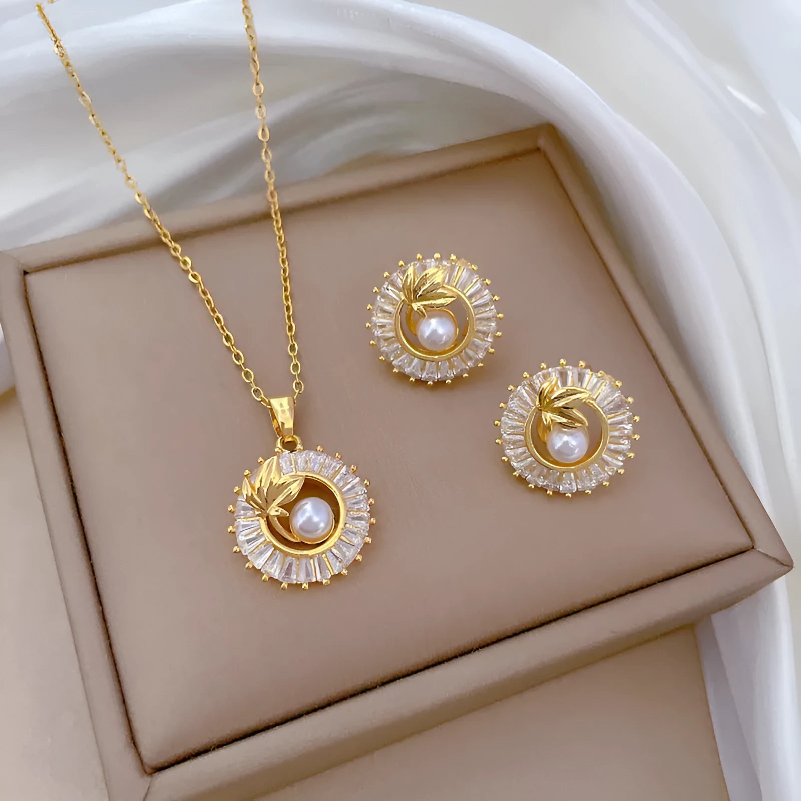 Brass leaf design jewellery set with titanium steel chain necklace and matching stud earrings