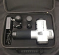 Black fascia massage gun with four attachment heads showing 29cm dimensions