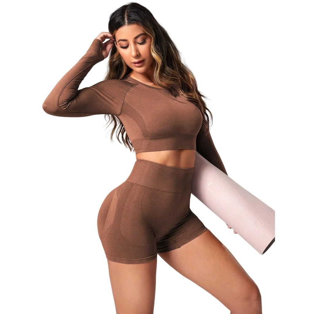 Women's black yoga suit set with long sleeve top and high-waist tight leggings laid flat.