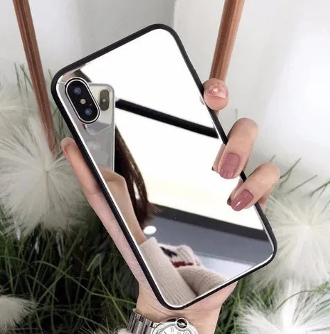 Black iPhone back cover case with a reflective mirror surface and self-timer function.