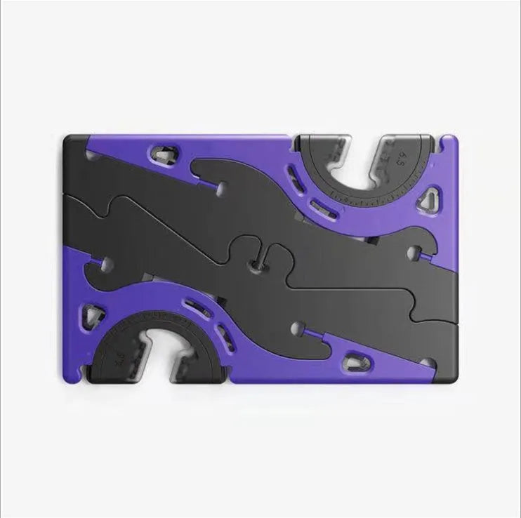 Black plastic card type mobile phone holder on desktop surface