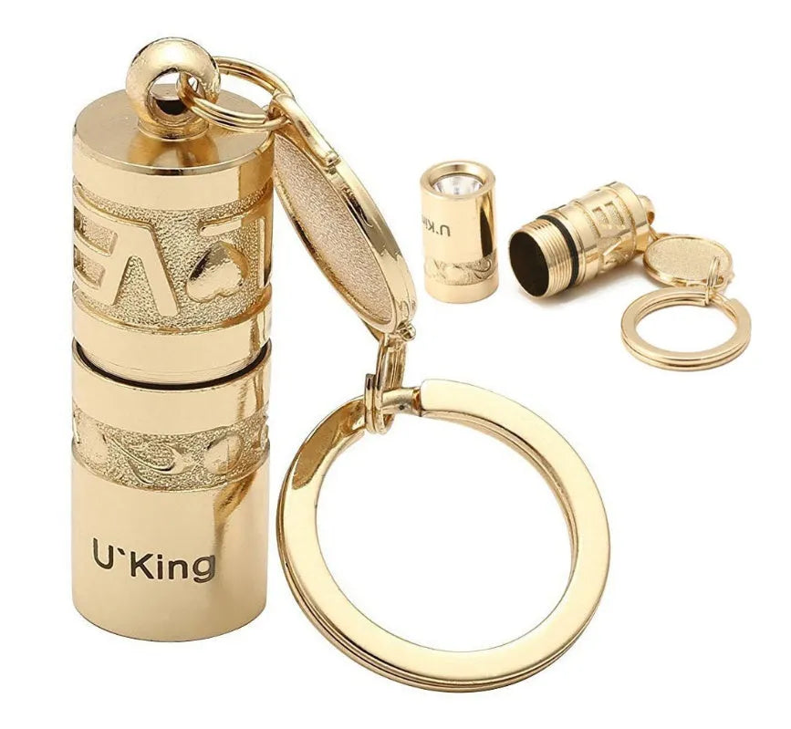 Gold waterproof LED flashlight keychain with zinc alloy die-cast housing and polished finish