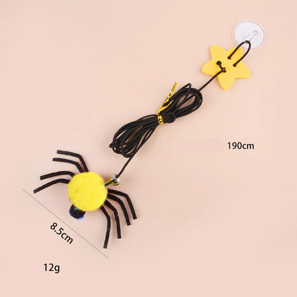 Red and yellow cat hanging door toy with elastic rope, feather stick, bell, and spider attachment.