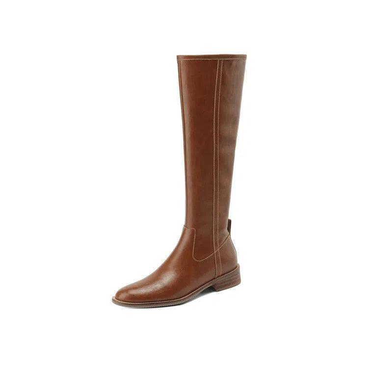 Women's black cowhide leather knee-high riding boots with chunky heel, round toe, and side zipper