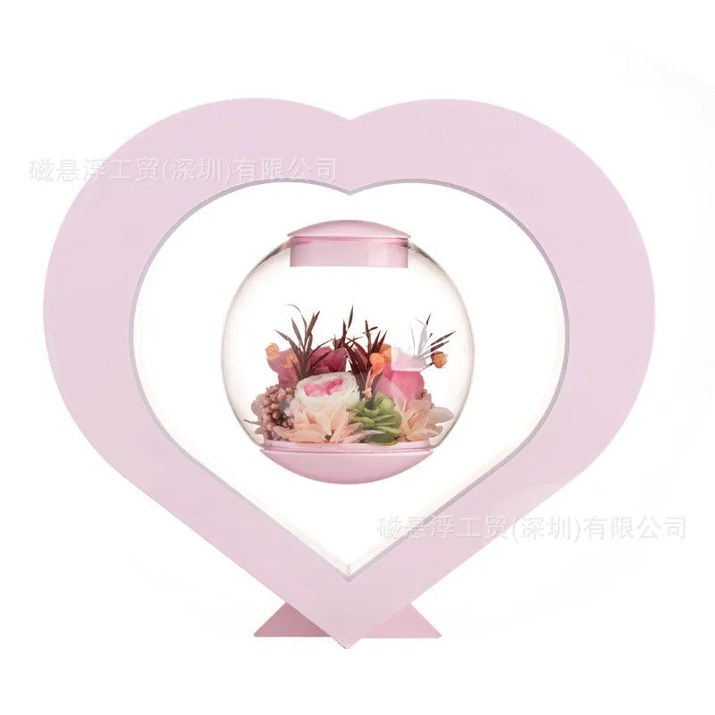 Pink preserved real rose ornament with optional base and Bluetooth audio speaker.