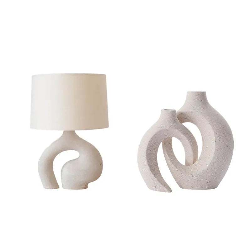 Modern minimalist table lamp with Nordic fabric shade on a bedside table