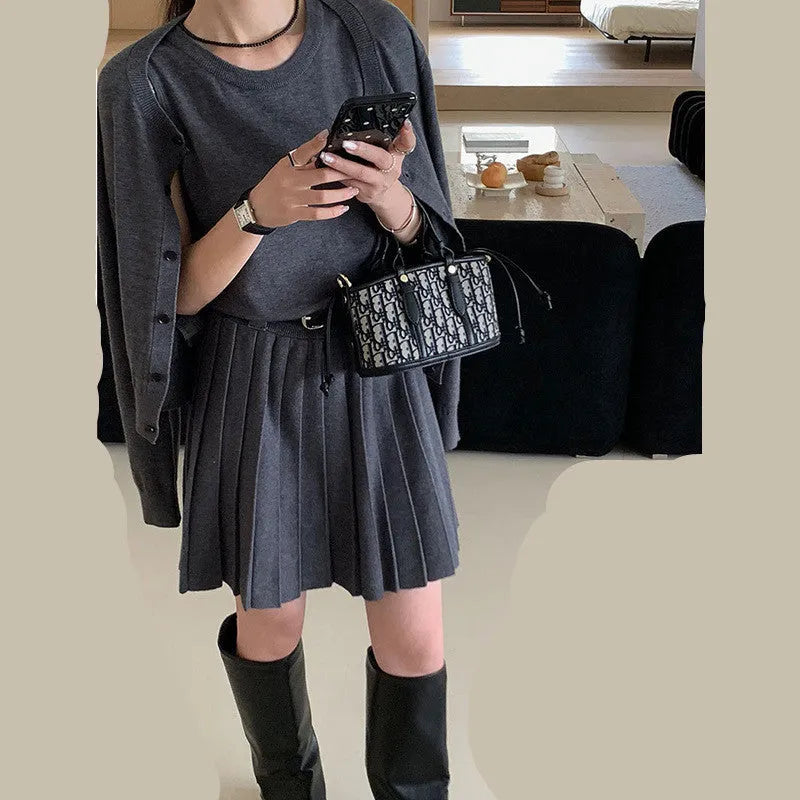 Grey art retro knitted vest skirt and long-sleeved cardigan two-piece set for women.