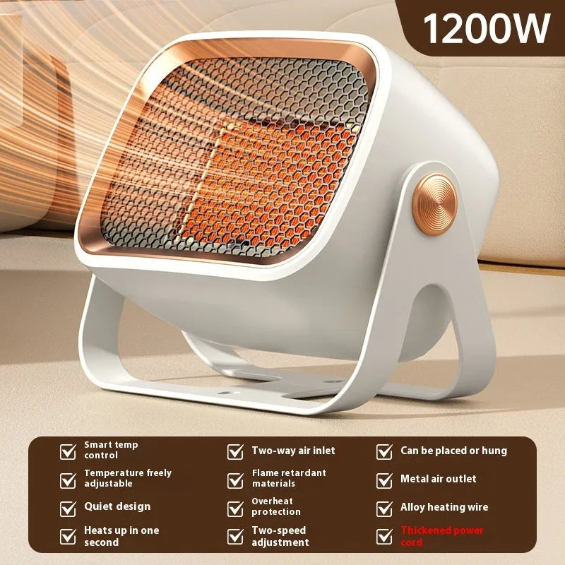 Grey compact desktop ceramic electric heater with rotatable body on a wooden desk.
