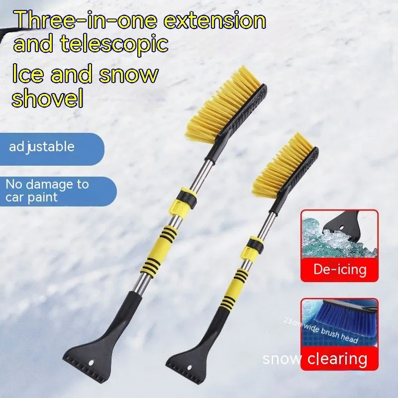 Yellow telescopic long-handled car snow brush and ice scraper on a snowy car windscreen.