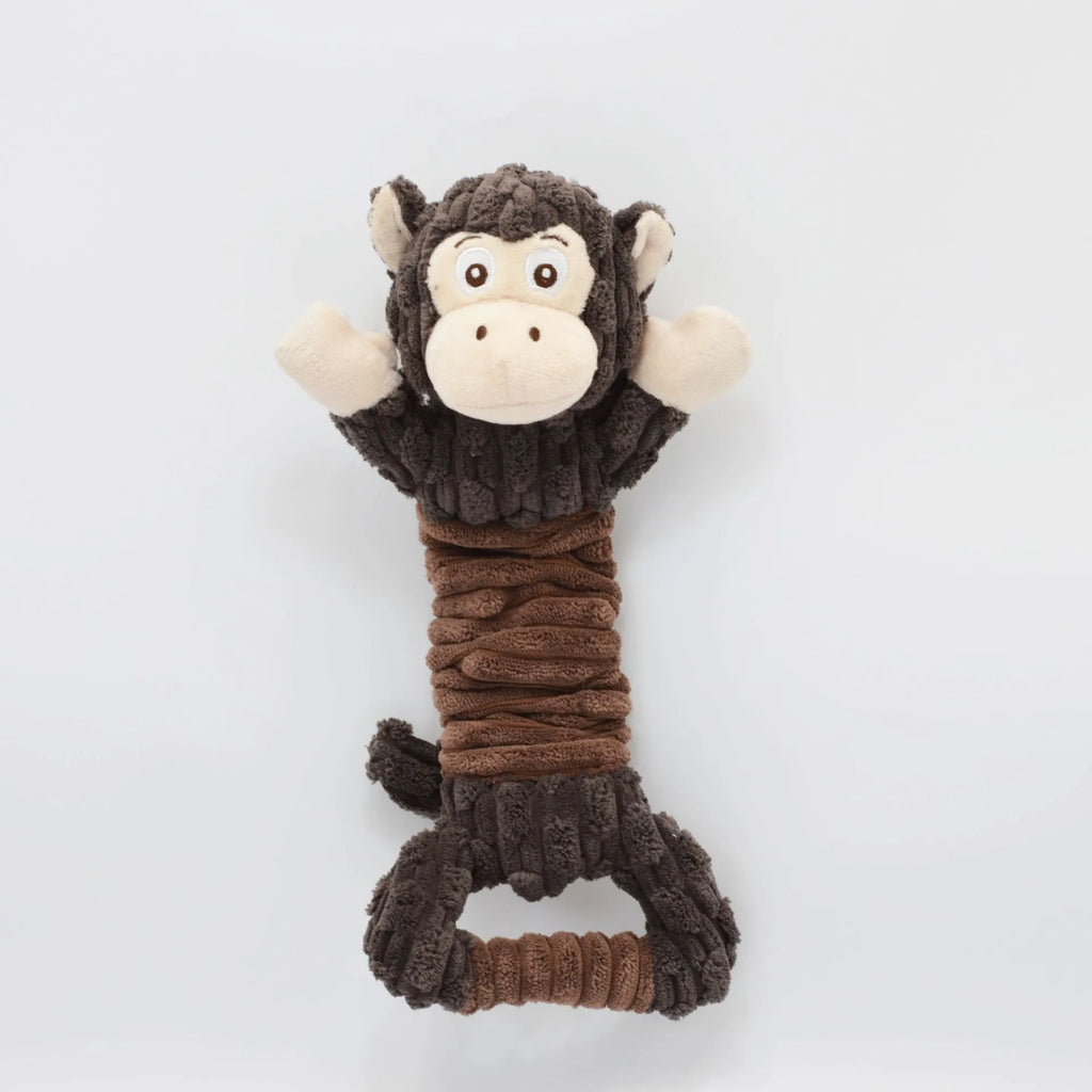 Large squeaky plush dog toy shaped like a hippo or monkey with a tug handle