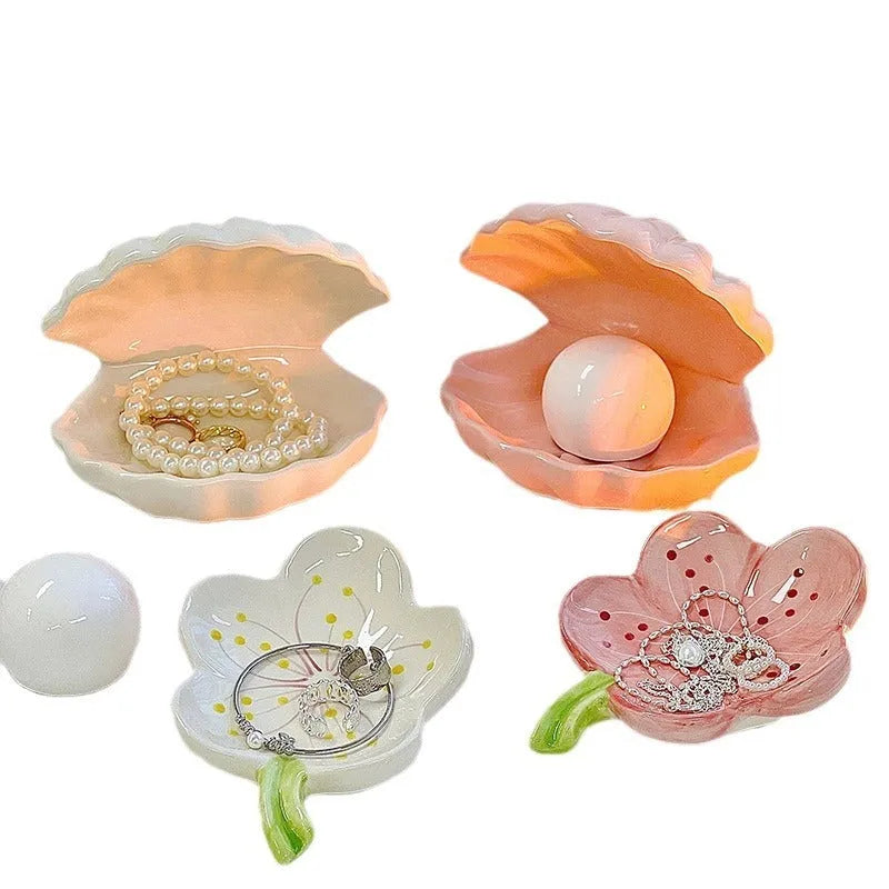 White porcelain night lamp with storage tray in modern design, available with pink or white shell options