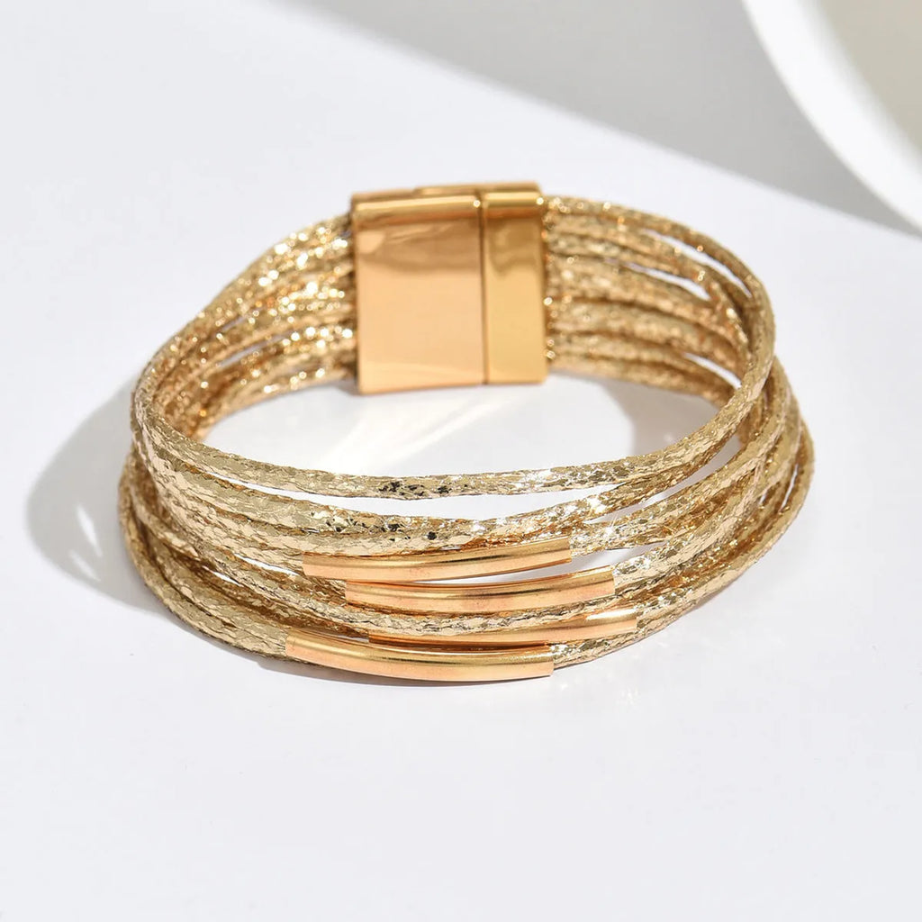 Multi-layer magnetic leather bracelet for women with round alloy element in gold, black, and coffee colours