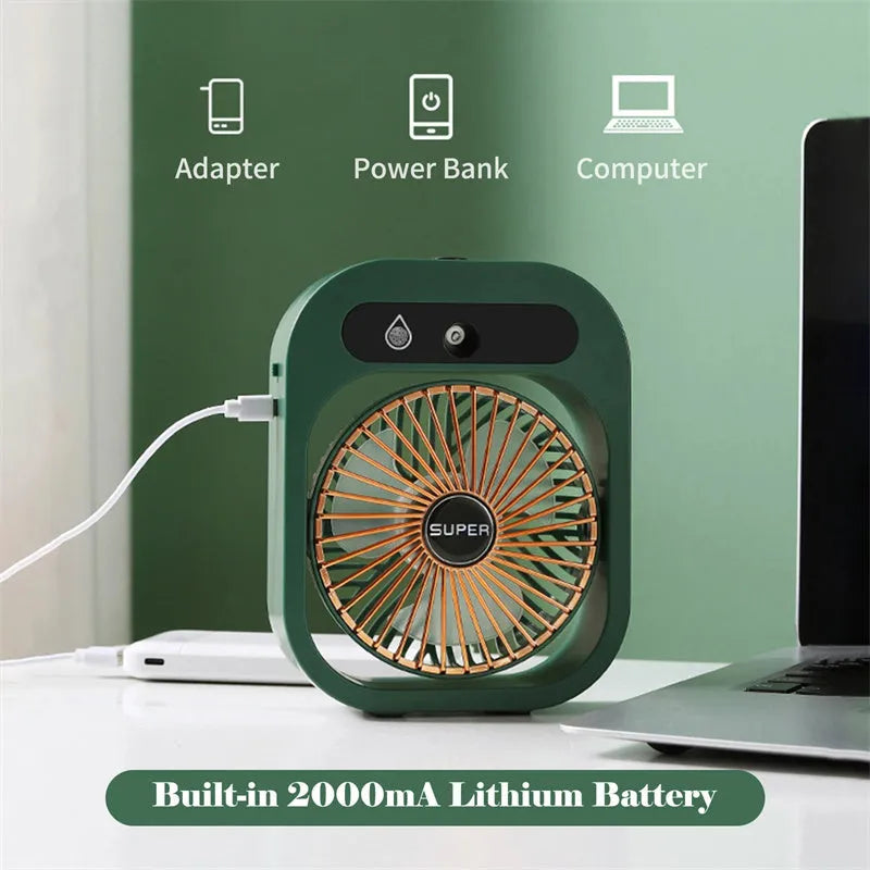 Green and white portable USB misting fan with water tank and adjustable air vent on a desk.