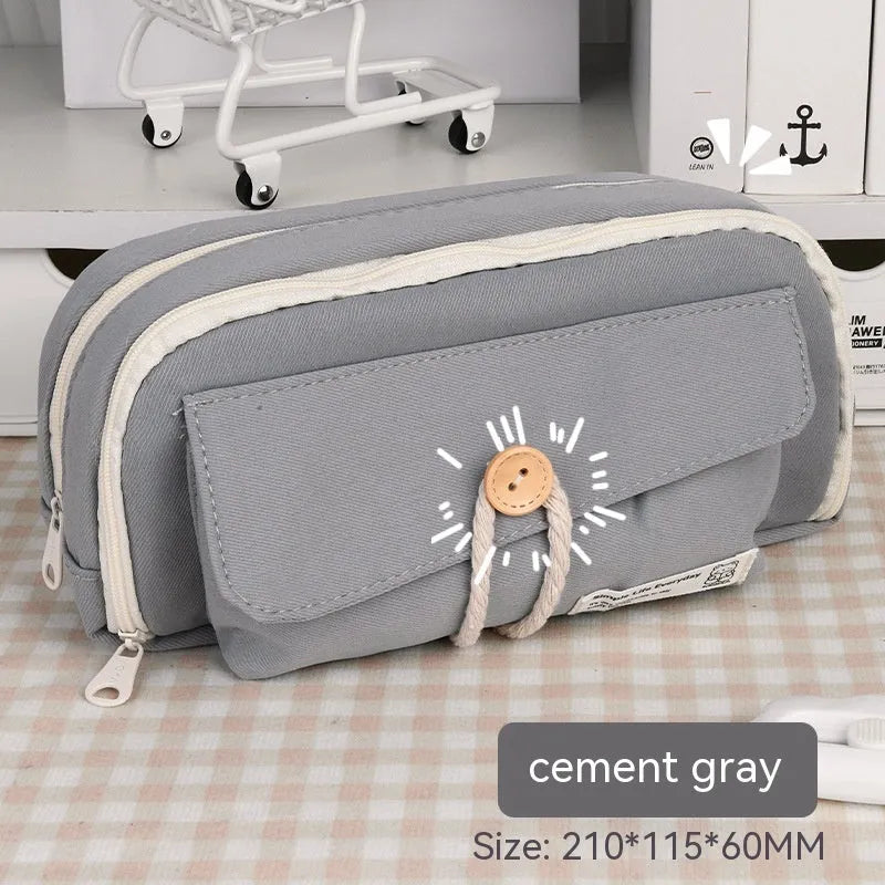 Canvas pencil case in green, beige, blue, or grey storing about 80 pens
