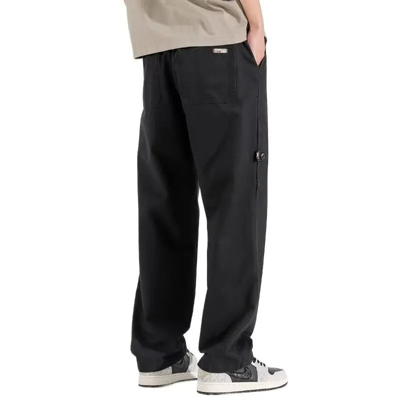 Women's loose wide-leg polyester blend trousers in black, mid-waist drawstring elastic waist, flat lay