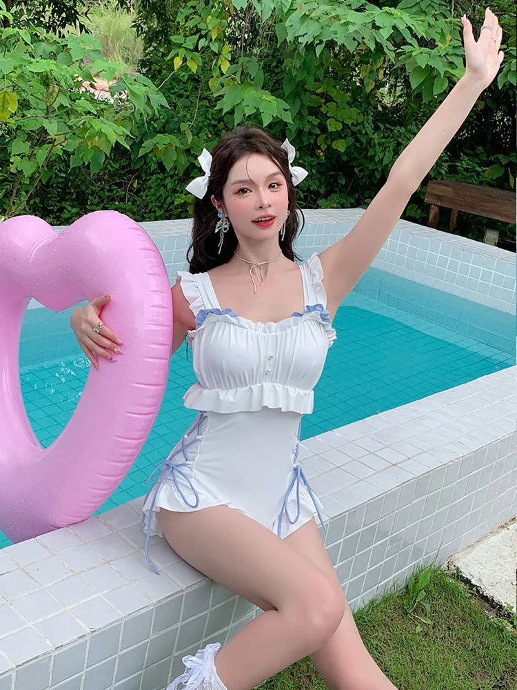 Women's Milky White backless one-piece nylon swimsuit on Asian size mannequin