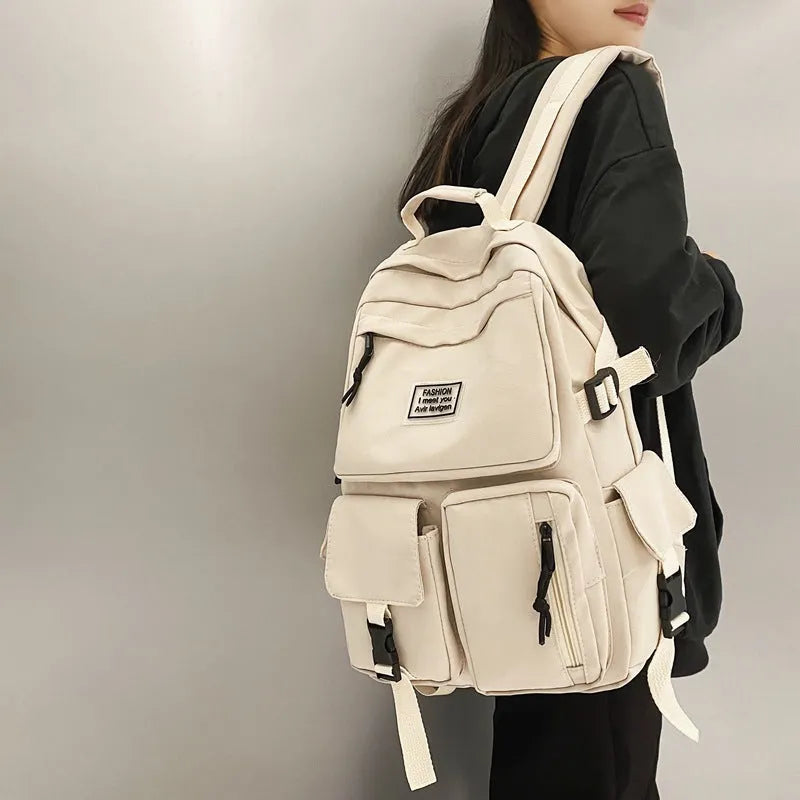 Soft nylon student backpack in black colour with computer compartment and three-dimensional pockets