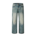 Retro distressed jeans for men in vintage blue cotton denim with worn-in finish, front view