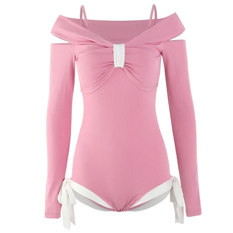 Women's long sleeve one-piece swimsuit in pink on a mannequin.